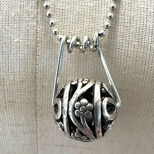Silver tone ball pendant necklace
